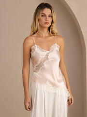 Pink mulberry silk camisole top with spaghetti straps, lace trim, and an asymmetrical hem.