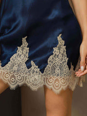 Navy blue mulberry silk spaghetti strap V-neck nightgown with delicate beige lace trim.