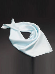 Light blue 100% Mulberry silk square scarf, 53x53cm, folded elegantly on a dark background.