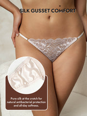 Women's light pink mulberry silk thong with lace trim and adjustable straps, featuring a pure silk gusset.