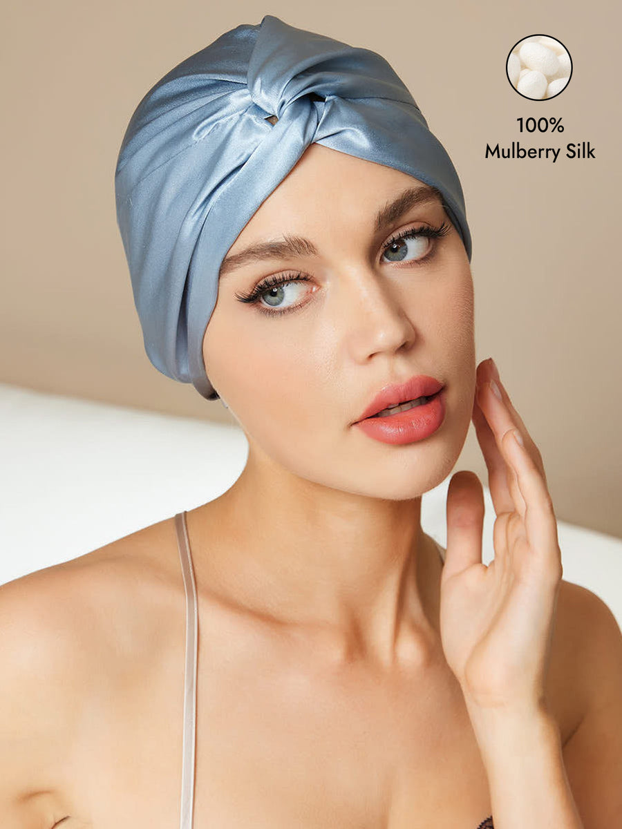 Steel Blue 100% Mulberry Silk Turban for Sleeping with a knot-front design, worn by a woman.