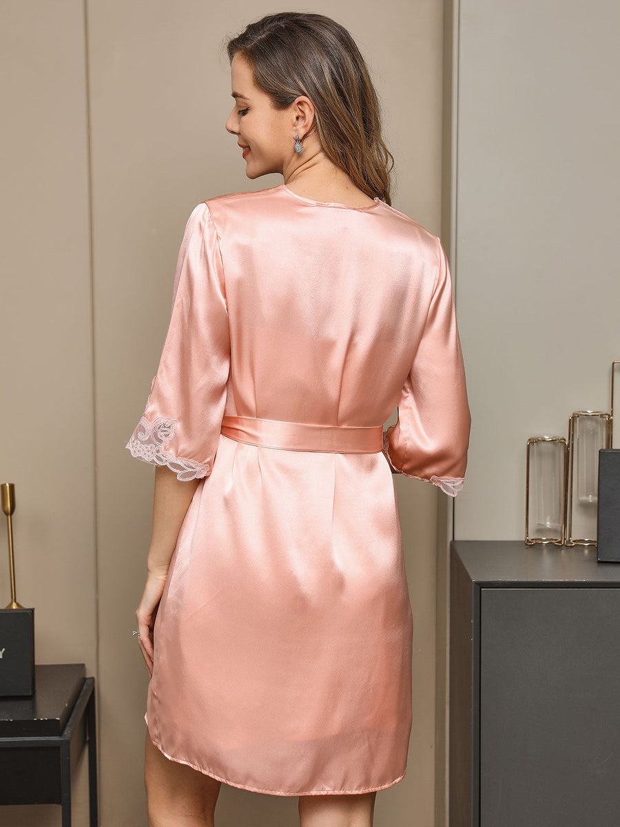 Women's pink mulberry silk robe with lace trim on sleeves and a tie waist.