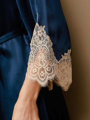 Navy blue mulberry silk robe sleeve with delicate beige lace trim.