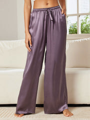 Women's mulberry silk wide leg pants in a soft purple hue, featuring a drawstring waist and pockets.