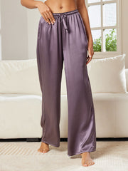 Women's mulberry silk wide-leg pants in a soft purple hue, featuring a drawstring waist.
