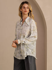 Women's mulberry silk lapel collar blouse with a subtle green and yellow floral print.