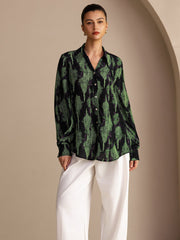 Women's mulberry silk lapel collar blouse in black with green abstract print, long sleeves.