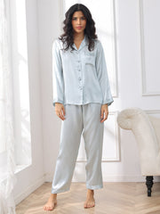 Women's light blue mulberry silk long sleeve pajama set with collared top and pants.