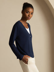 Women's navy blue mulberry silk V-neck long sleeve cardigan with buttons.