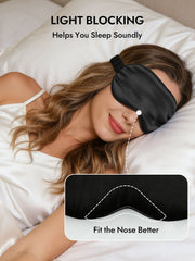 Woman wearing a black 19 momme pure mulberry silk sleep eye mask with an elastic band, designed for light blocking and a better nose fit.