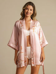 Pink 19Momme mulberry silk kimono robe with crane print, 3/4 sleeves, worn by a woman.