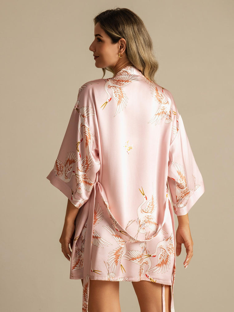 Pink 19Momme mulberry silk kimono robe with crane print, 3/4 sleeves, and wrap design for women.