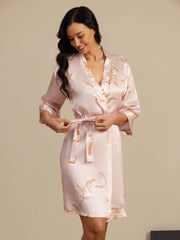 Women's 19Momme mulberry silk kimono robe in pink with crane print, belted wrap style.