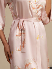 Women's pink 19Momme mulberry silk kimono robe with crane print and belted wrap style.