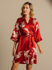 Women's red mulberry silk kimono robe with white crane print and belted wrap style.