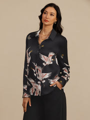 Women's black 19Momme mulberry silk long sleeve blouse with lapel collar and crane print.