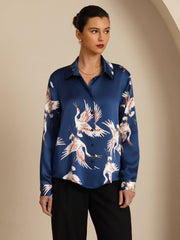 Women's navy mulberry silk blouse with white and orange crane print, long sleeves, and lapel collar.