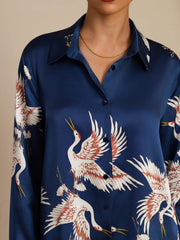 Women's navy 19Momme mulberry silk long sleeve blouse with lapel collar and crane print.