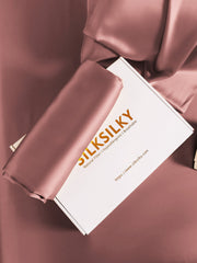 Rose gold 19 Momme mulberry silk pillowcase with hidden zipper, folded in a white box.