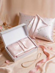 Snowbud Lily 19Momme Mulberry Silk Pillowcase in gift box with floral pattern, pearls, and ribbon.