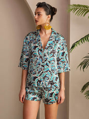 Women's 19Momme mulberry silk botanical print short sleeve button-up pajama set in blue, black, and white.