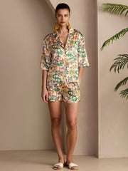Women's 19Momme mulberry silk pajama set with short sleeve button-up top and shorts, featuring a colorful crocodile print.