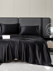 Black 19 Momme mulberry silk bedding set with fitted sheet, flat sheet, and two pillowcases.