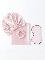 Pink 19Momme mulberry silk beauty sleep set with bonnet, scrunchie, pillowcase, and eye mask.