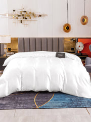 White 19Momme Mulberry Silk seamless duvet cover on a bed with a modern headboard and abstract rug.