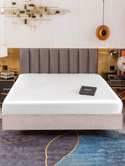 White 19 Momme Mulberry silk seamless fitted sheet on a bed with a black product box.