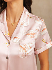 Pink 19Momme mulberry silk women's pajamas with crane print, short sleeves, and notch collar.