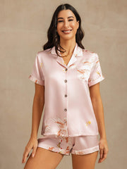 Pink 19Momme mulberry silk women's pajamas with crane print, short sleeves, and notch collar.