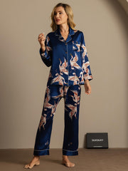 Women's 19Momme mulberry silk pajamas in navy with a crane print, long sleeves, and notch collar.