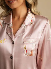Women's pink 19 Momme mulberry silk pajama top with crane print, notch collar, and pocket.