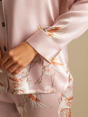 Women's 19Momme pure mulberry silk pajamas in pink with crane print, long sleeve, and notch collar.