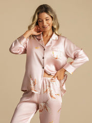 Women's 19Momme mulberry silk pajamas in pink with crane print, long sleeve, and notch collar.