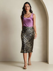 Women's mulberry silk leopard print stretch straight long skirt with a purple silk top.