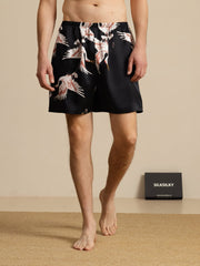 Men's black mulberry silk sleep shorts with white and red crane print, elastic waist.