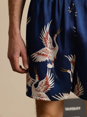 Men's navy mulberry silk sleep shorts with white and red crane print, elastic waist.