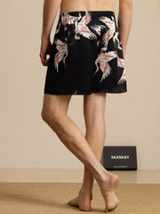 Men's black mulberry silk sleep shorts with white and red crane print, elastic waist.