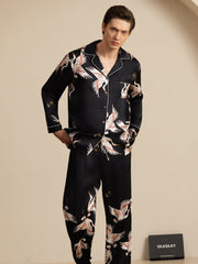 Men's black mulberry silk pajamas with white crane print and notch collar.