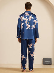 Men's mulberry silk pajamas in blue with a white crane print, long sleeve and notch collar style.