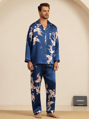 Men's mulberry silk pajamas in blue with white crane print, long sleeves, and notch collar.
