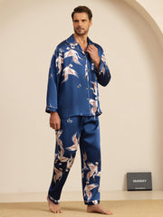 Men's navy blue mulberry silk pajamas with white crane print, long sleeves, and notch collar.