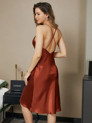 Women's mulberry silk spaghetti strap V-neck knee nightgown in rust with criss-cross back design.
