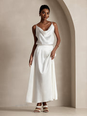 Woman in a white 19Momme mulberry silk A-line maxi skirt with lining and matching silk top.