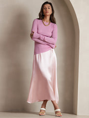 Pink 19Momme silk A-line maxi skirt with zipper design, paired with a long-sleeve top.