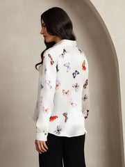 Women's white 19 Momme mulberry silk long-sleeve lapel collar shirt with colorful butterfly print.