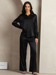 Women's black 19 Momme mulberry silk button-up shirt and wide-leg pants set.