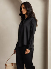 Women's black 19 Momme mulberry silk button-up shirt with long sleeves.